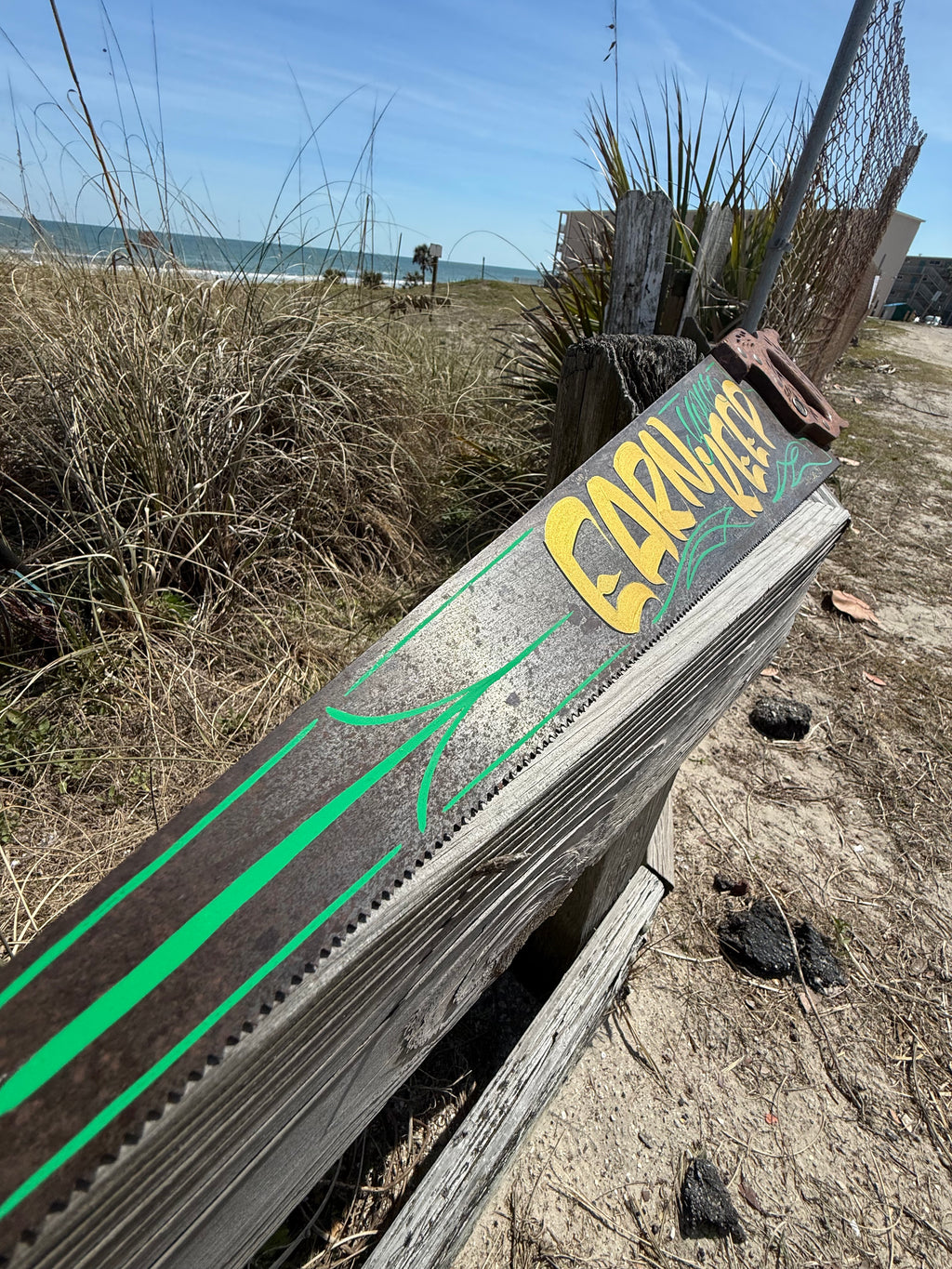 Earn Your Keep hand painted saw