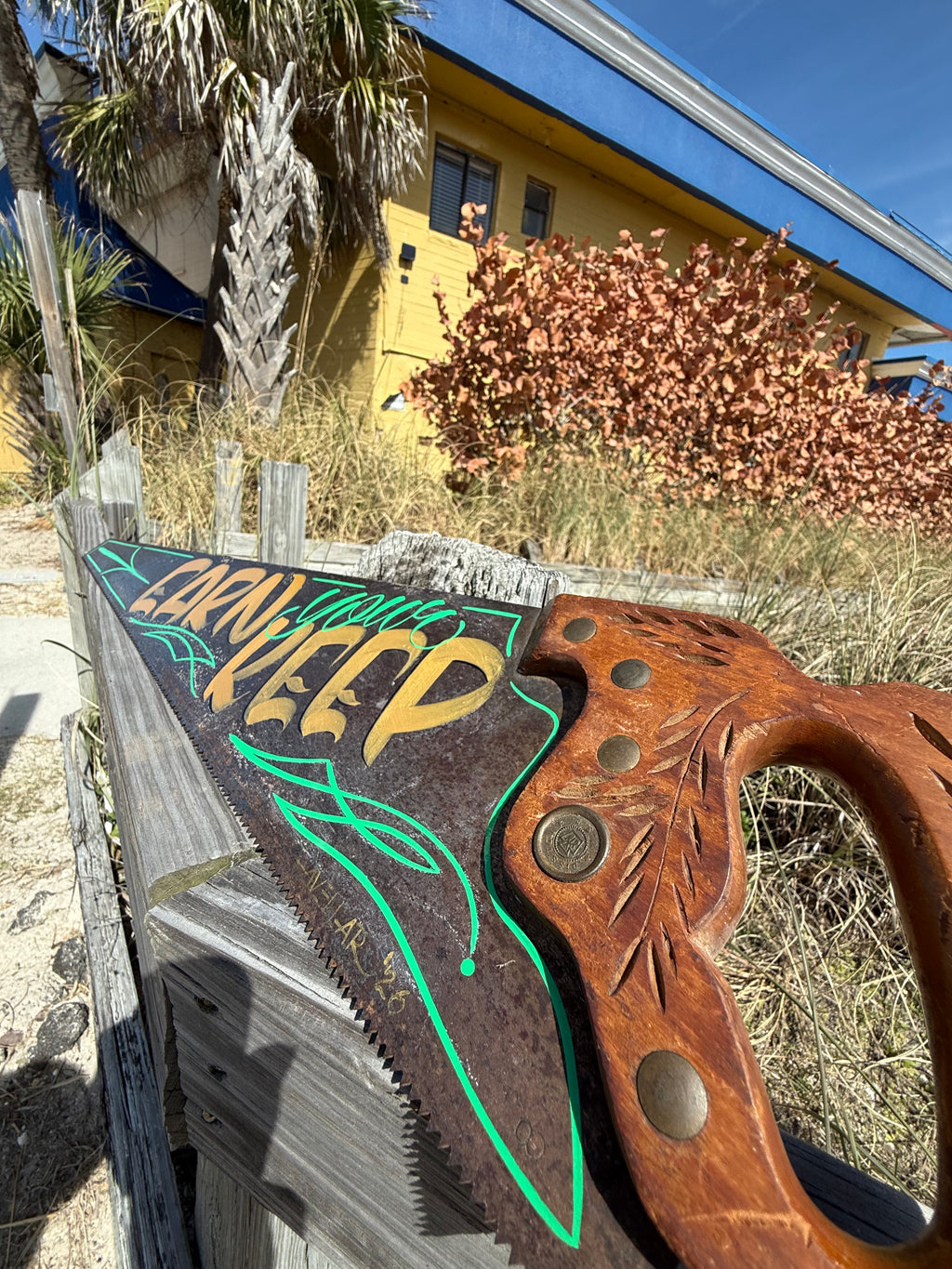 Earn Your Keep hand painted saw